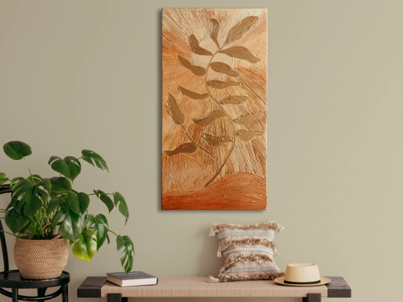 Mixed media art with texture in bronze colors showing a plant in the summer sun
